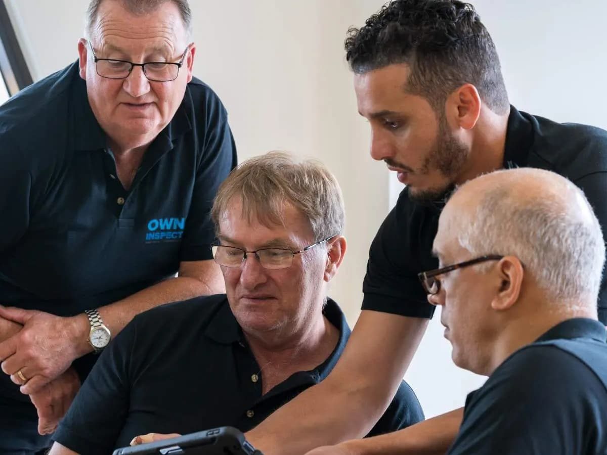 Owner Inspections inspectors going through a report